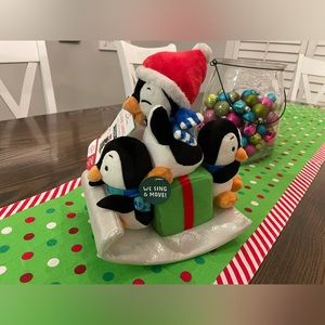 Hallmark Sledding Surprise animated plush inspired by playful penguins